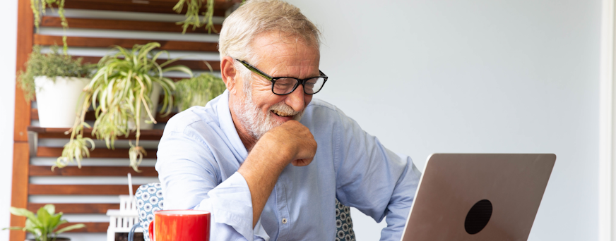 Life Assure Senior Woman Sitting In Chair And Laughing With Caregiver Nurse Hero